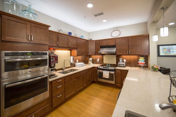 Modern kitchen interior with wooden cabinets and appliances