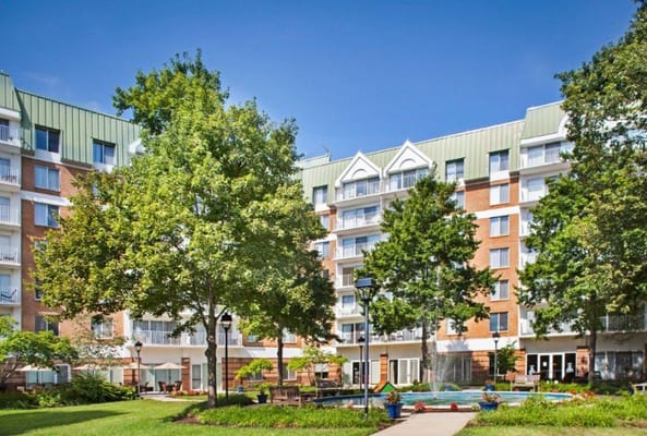 Exterior view of Bedford Court building with landscaped garden