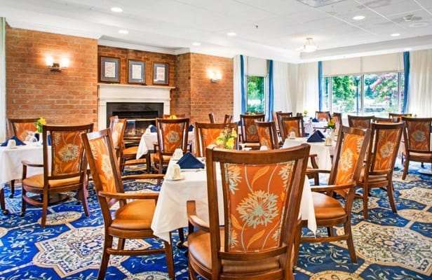 Elegant dining room setup with flowers and table settings