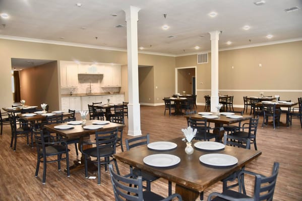 Dining room setup with tables and chairs