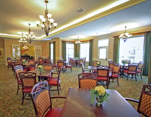 Bright dining area with tables and chairs in a common space