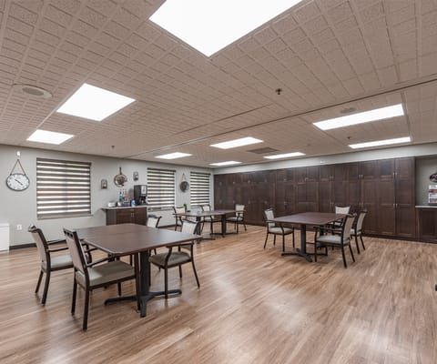 Bright common area with tables and chairs