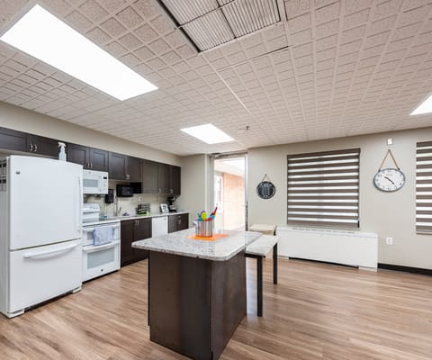 Bright interior of a facility kitchen with modern appliances