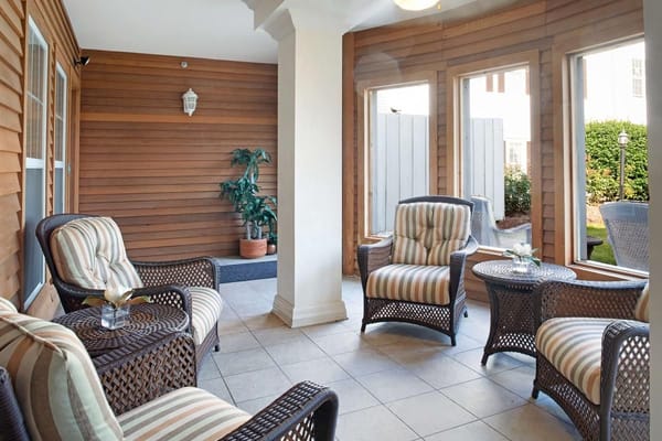 Cozy outdoor seating area with chairs and plants