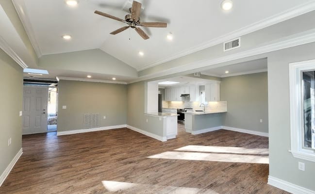 Spacious interior common area with wood flooring