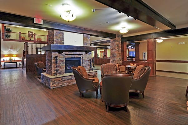 A cozy common area with seating and a fireplace