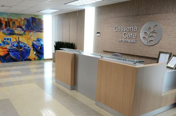 Reception area with modern decor and artistic mural