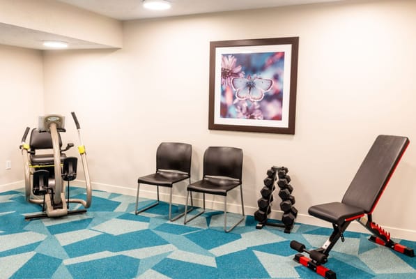 Interior gym space with exercise equipment
