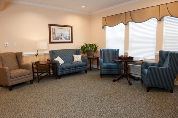 Cozy common area with comfortable seating and chess table