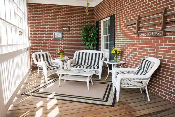 Cozy lounge area with striped furniture and plants