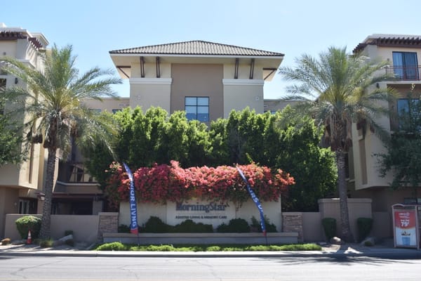 Front entrance of MorningStar Assisted Living & Memory Care with lush landscaping