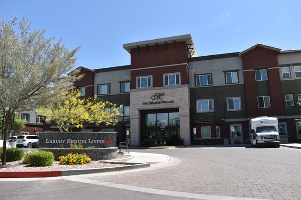 Main entrance of The Manor Village senior living facility