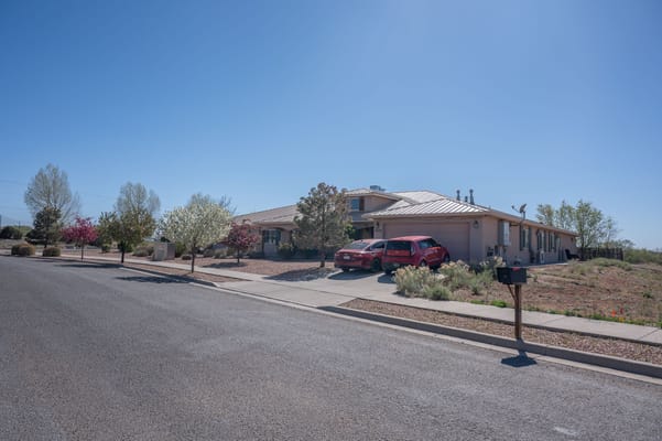 Exterior view of a senior living facility with landscaping