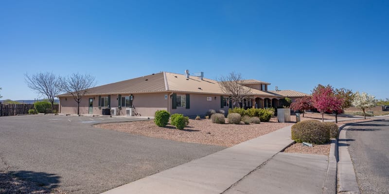 Exterior view of a senior living facility with landscaping