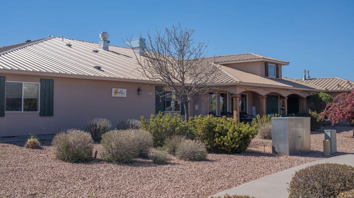 Exterior view of an assisted living facility with landscaping