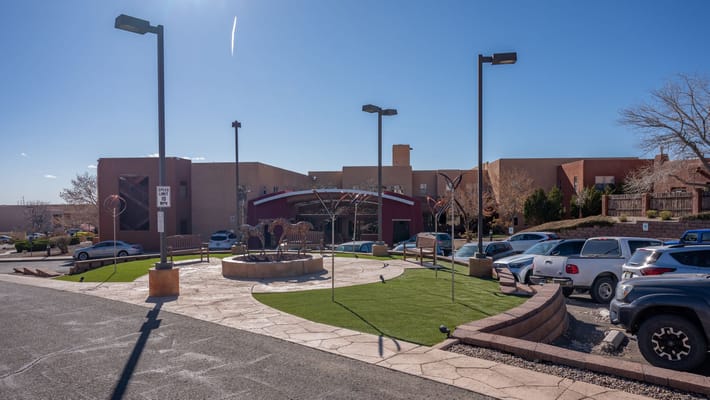 The Montecito Santa Fe entrance with landscaping and parking area.