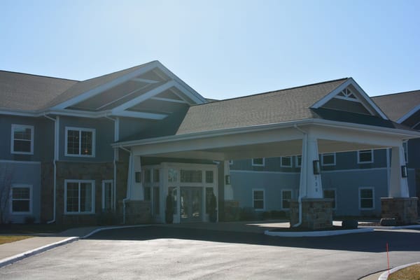 Entrance of Provision Living of Forest Hills with covered driveway