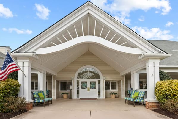 Exterior view of a senior living facility with a welcoming entrance