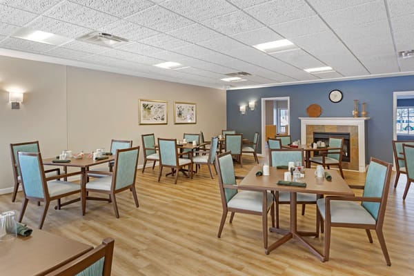 Spacious dining room with tables and chairs at Duluth Heights Lodge
