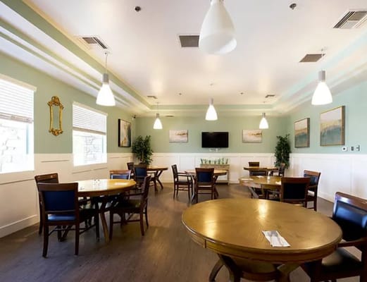 Bright dining room with wooden tables and chairs