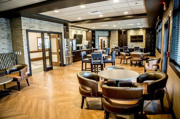 Spacious lounge area with seating and modern decor.