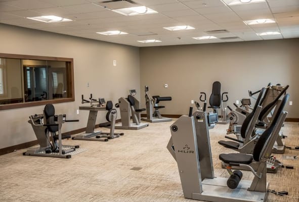 Exercise equipment in the gym area of Eventide Fargo