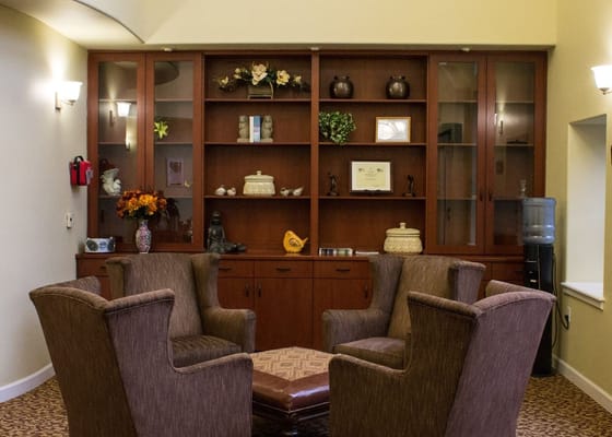 Comfortable seating area with a coffee table and cabinet display