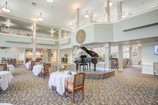Bright interior dining area with a piano