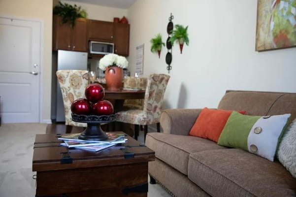 Cozy living room with tasteful decor and dining area