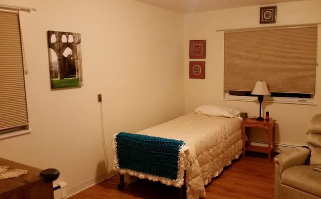 A cozy private room with a bed and decor