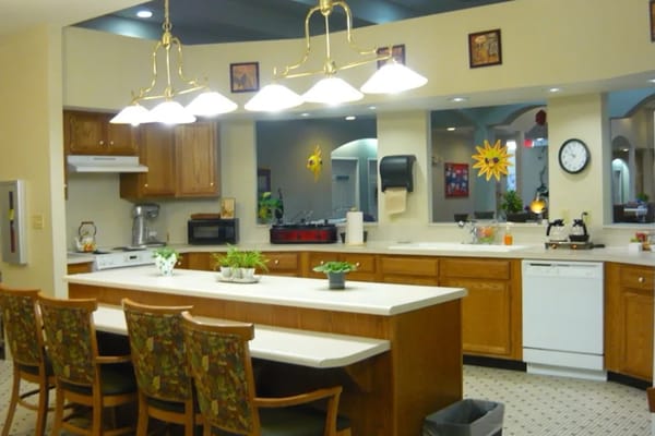 Bright, welcoming kitchen area with seating