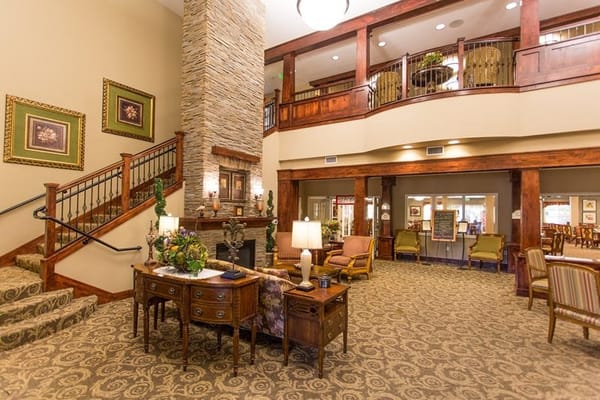 Cozy lobby featuring a stone fireplace and comfortable seating