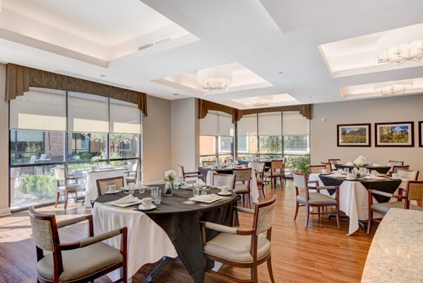 Elegant dining room setup with tables and chairs