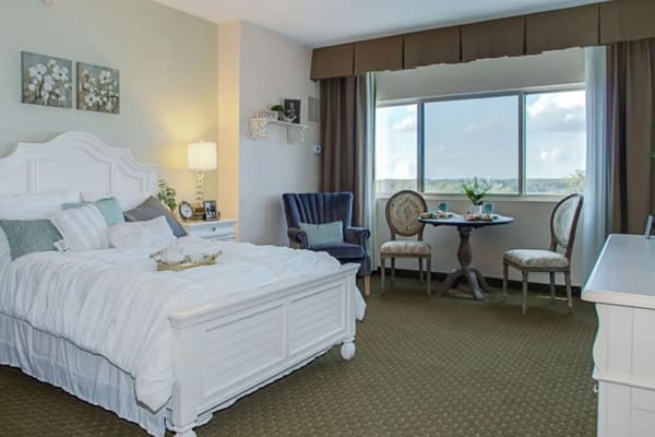 Well-furnished resident room with natural light