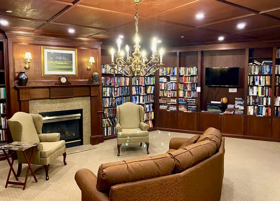 Cozy library with bookshelves and seating area