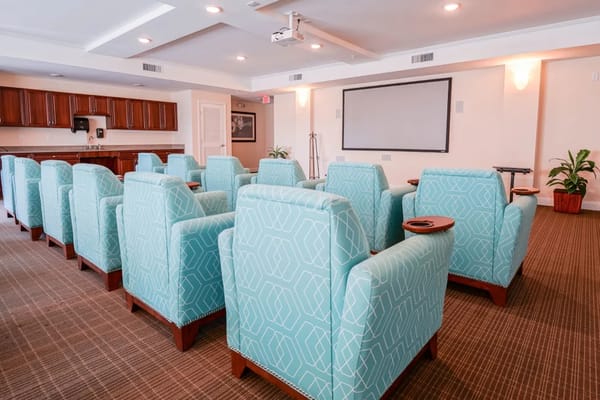 Bright common area with turquoise seating