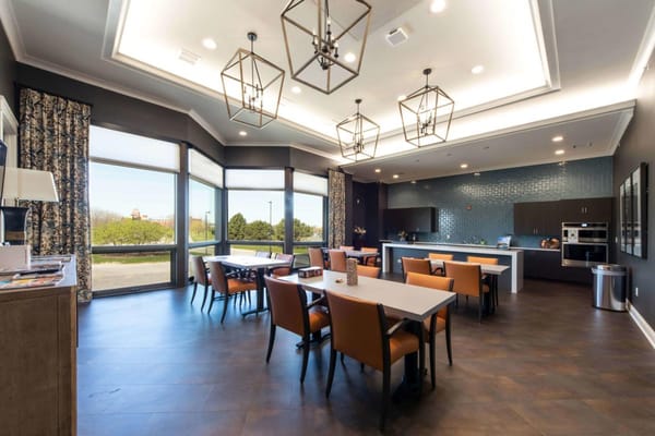 Bright modern dining area with tables and chairs