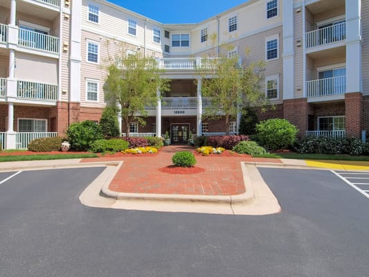 Front entrance of Holiday Gardens at Wakefield surrounded by greenery