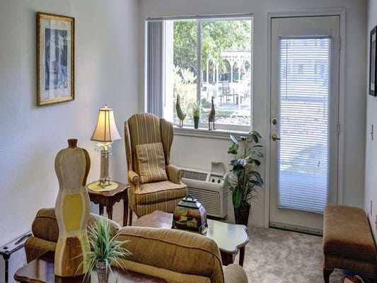 Welcoming living room with a comfortable chair and decorative lamp
