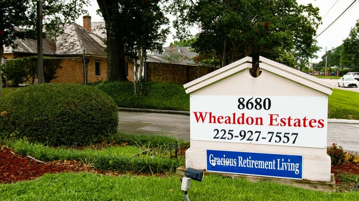 Sign for Whealdon Estates with address and contact information