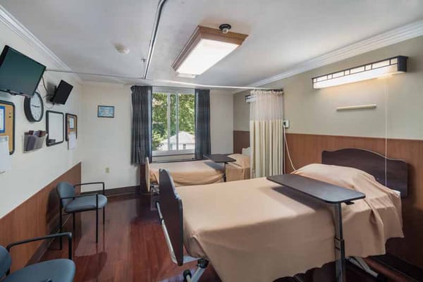 Clean and well-organized resident room with beds