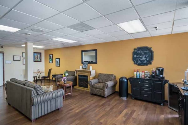 Lounge area with seating and decorative wall