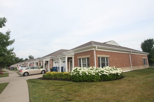 Exterior of residential homes with landscaped flowers at Traditions at Solana.