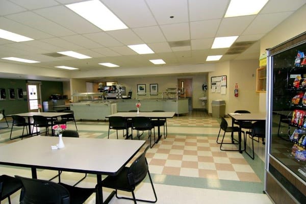 Dining area with tables and a service counter
