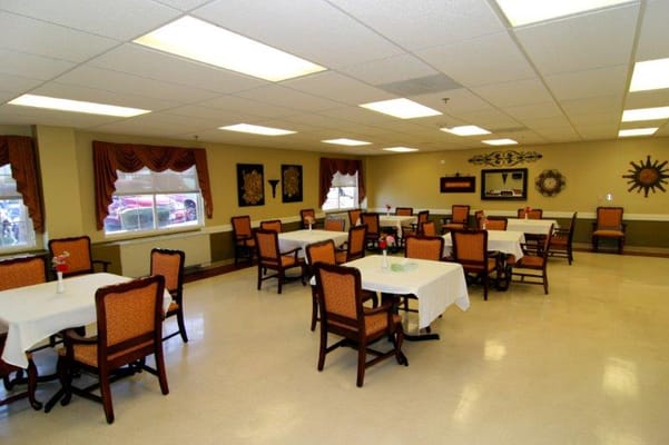 Dining area with tables and chairs in a spacious setting