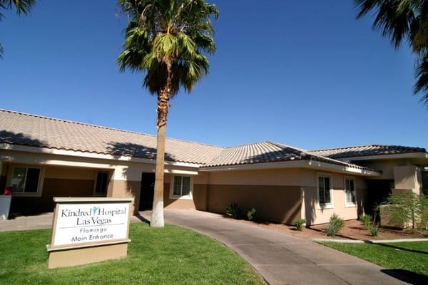 Main entrance of Kindred Hospital Las Vegas with landscaping