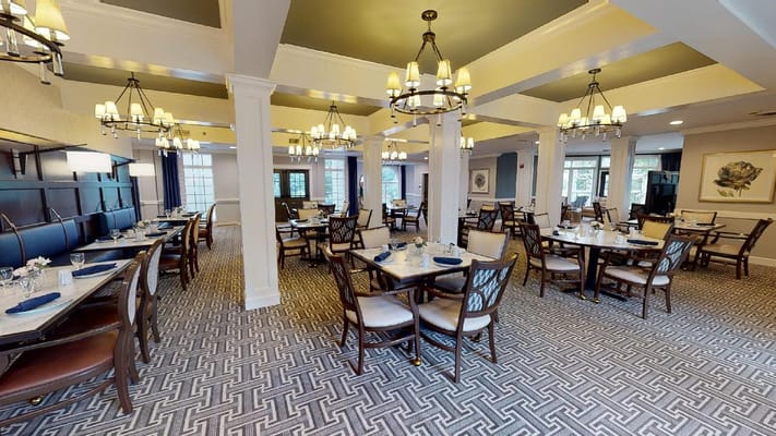 Dining room setup with tables for residents