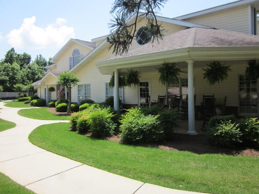 Front view of Legacy Ridge at Peachtree with lush gardens and walking paths.