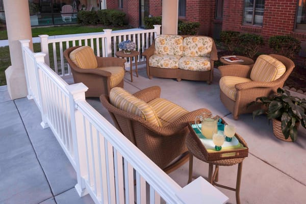Outdoor seating area with comfortable chairs and drinks