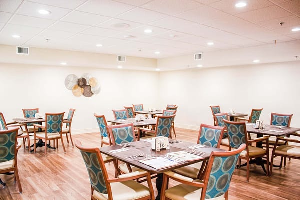 Bright dining room with tables and chairs